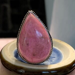 Gorgeous pink gemstone with a stunning sterling silver setting. Size 5.